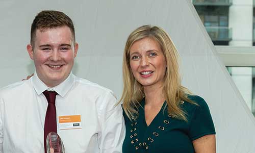 Photo of Luke Collinson holding his award for undergraduate of the year