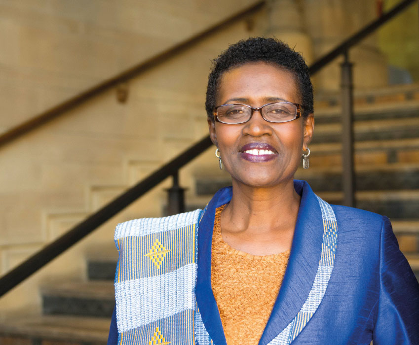 Winnie Byanyima standing in The University of Manchester's Whitworth Hall
